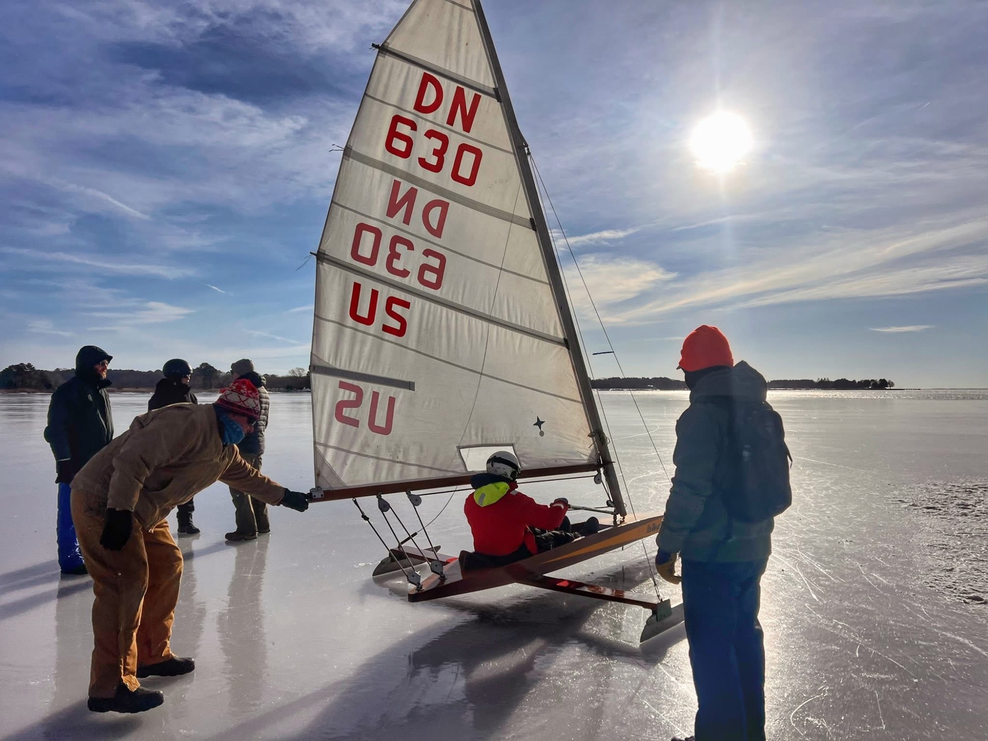 DN iceboat US 630 being rigged on the ice at Claiborne with crew helping