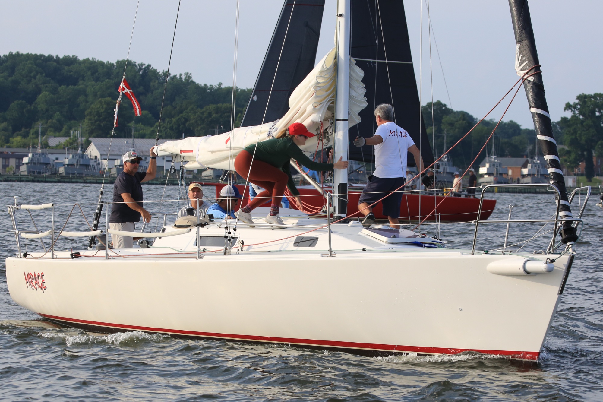 Crew of J/105 Mirage motoring out to the start line in Annapolis harbor