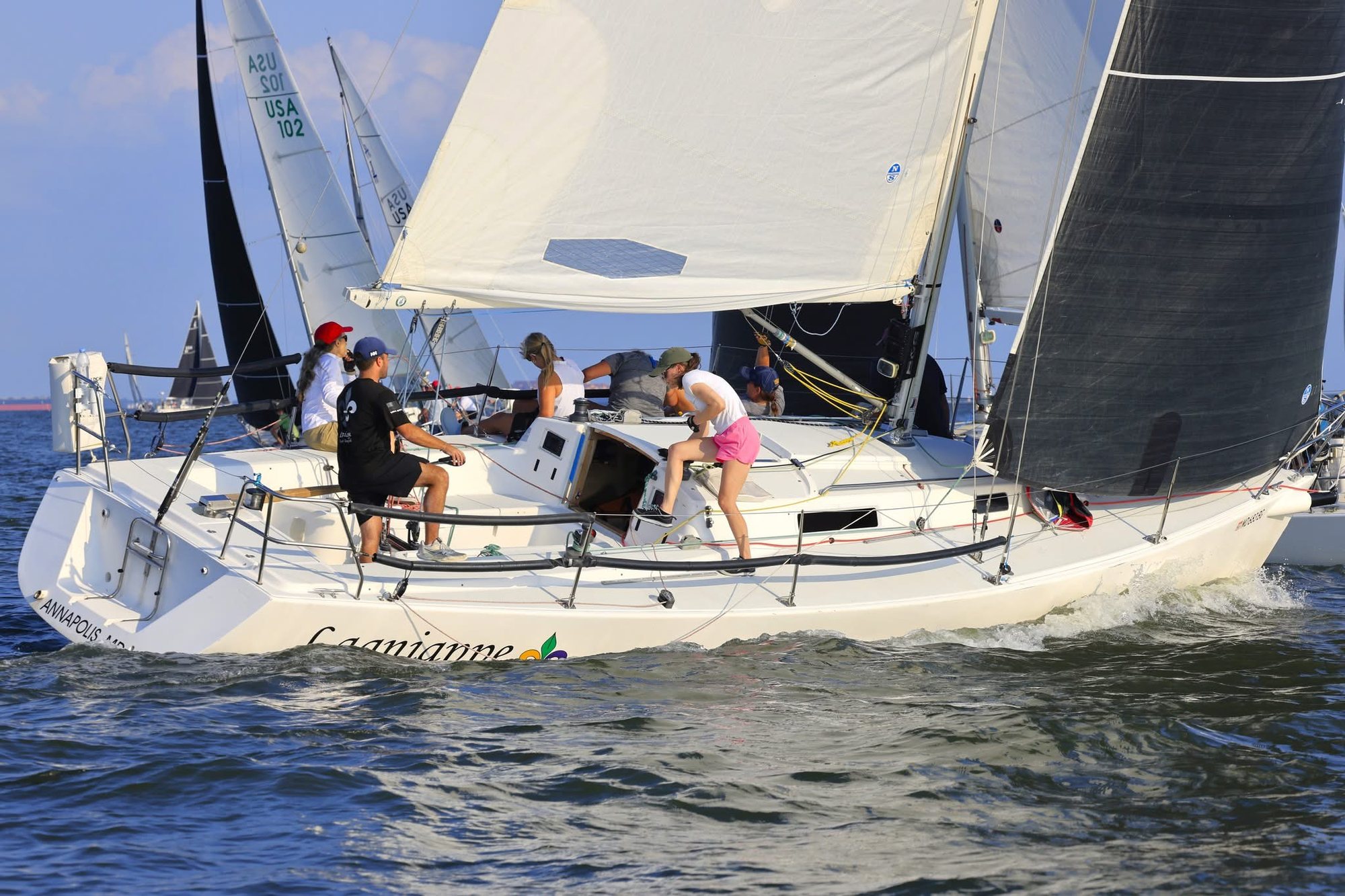 A full crew working the deck of a J/105 racing on the Chesapeake